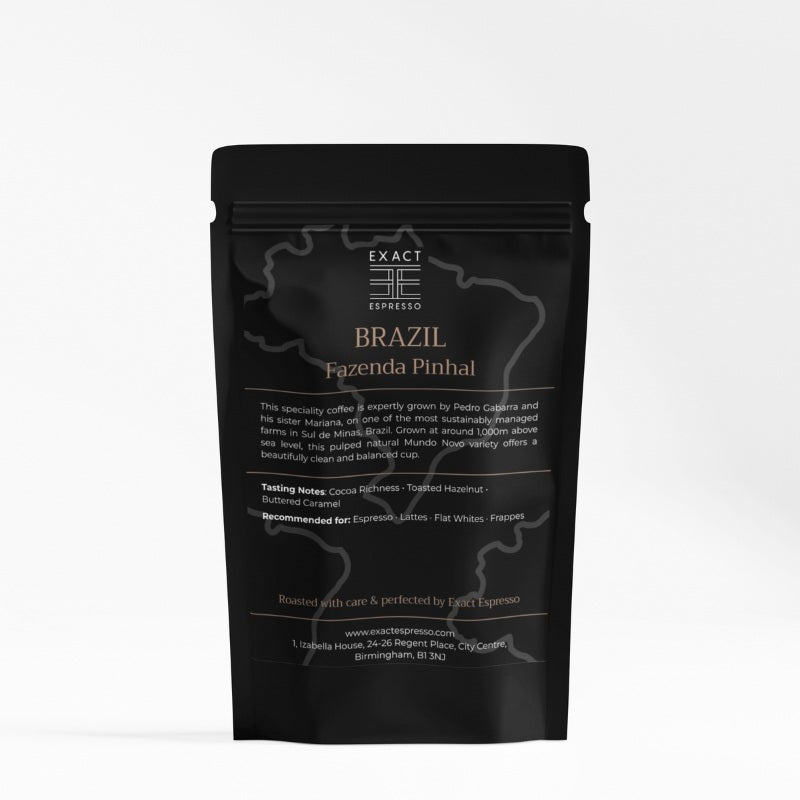 Black Exact Espresso coffee bag labelled "Brazil Fazenda Pinhal" with tasting notes and origin details.