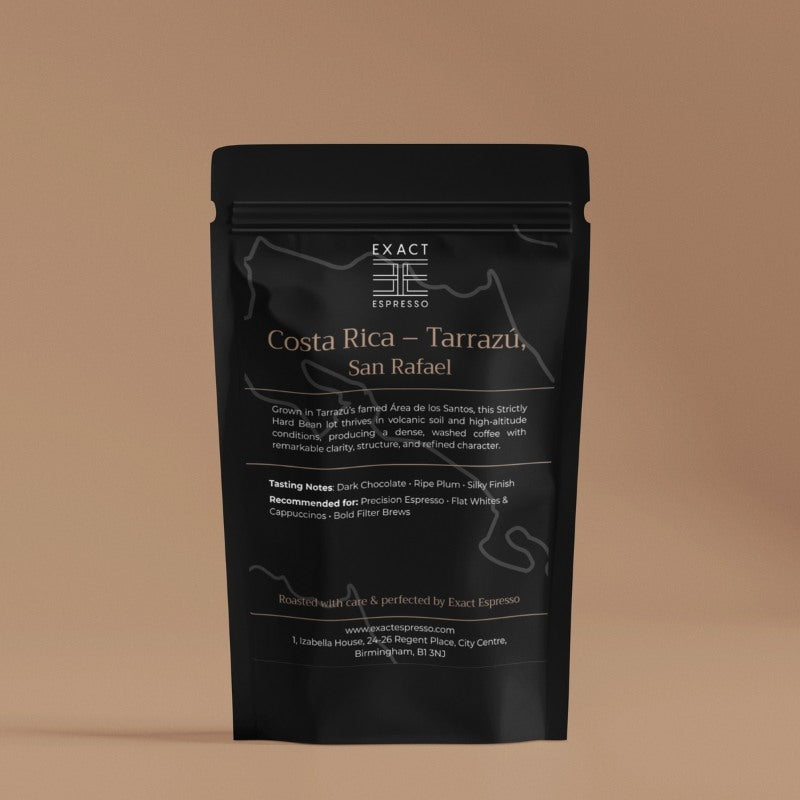 Front-facing black coffee bag labeled “Costa Rica – Tarrazú, San Rafael” with tasting notes and brewing recommendations on a tan background.