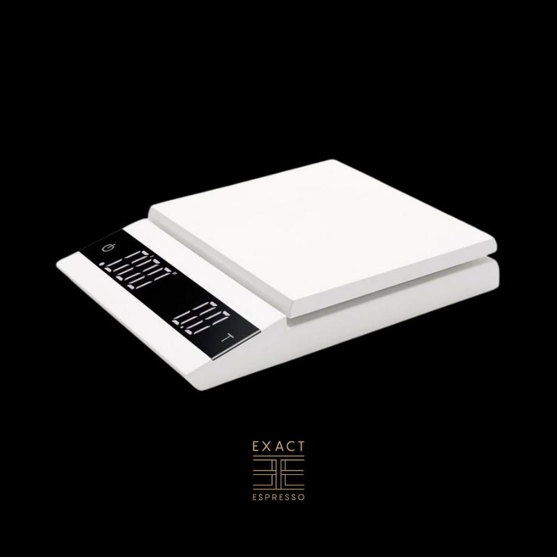 A white digital coffee scale with a dual LED display against a black background.A white digital coffee scale with a dual LED display against a black background.
