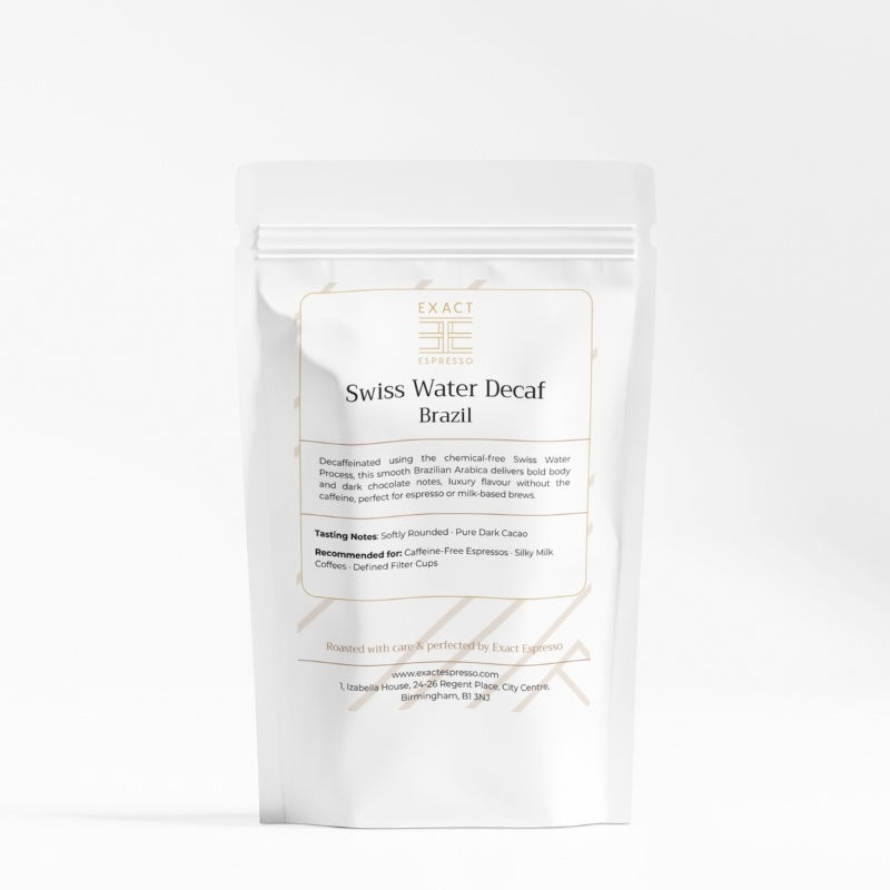 White Exact Espresso Swiss Water Decaf coffee bag with minimalist label and gold logo on clean white background.
