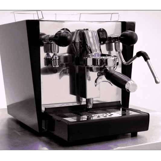 Fracino cherub espresso machine, steam wand and one portafilter in black and chrome on a kitchen top