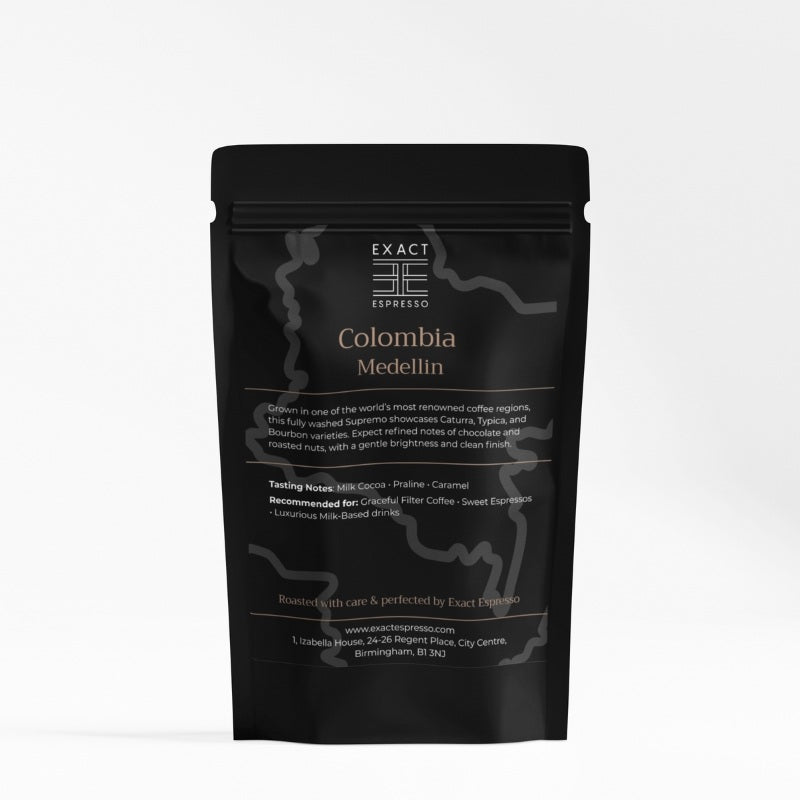 Black coffee bag labeled "Colombia Medellin" with tasting notes and recommended uses printed on front.
