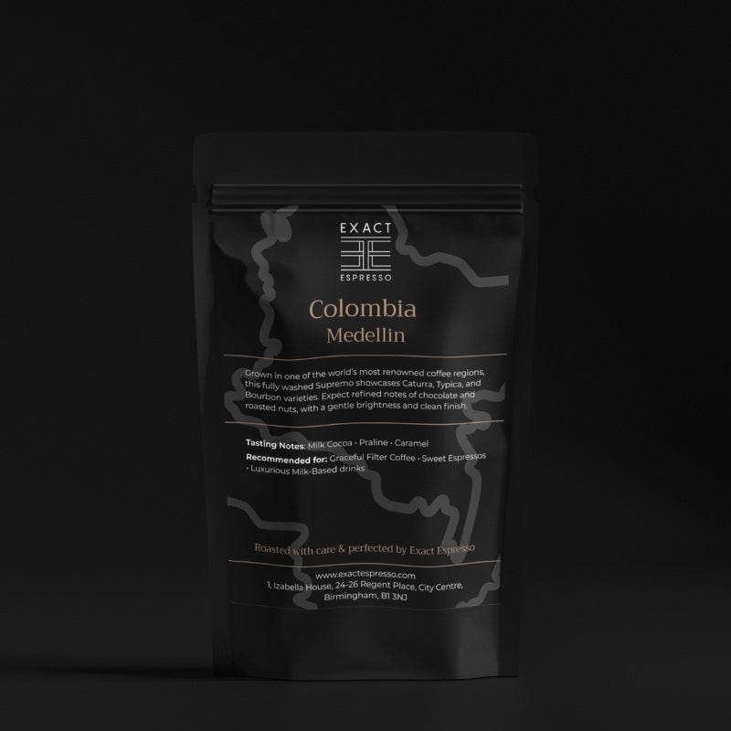 Elegant black bag of Colombia Medellin coffee beans on a dark background with refined text layout.