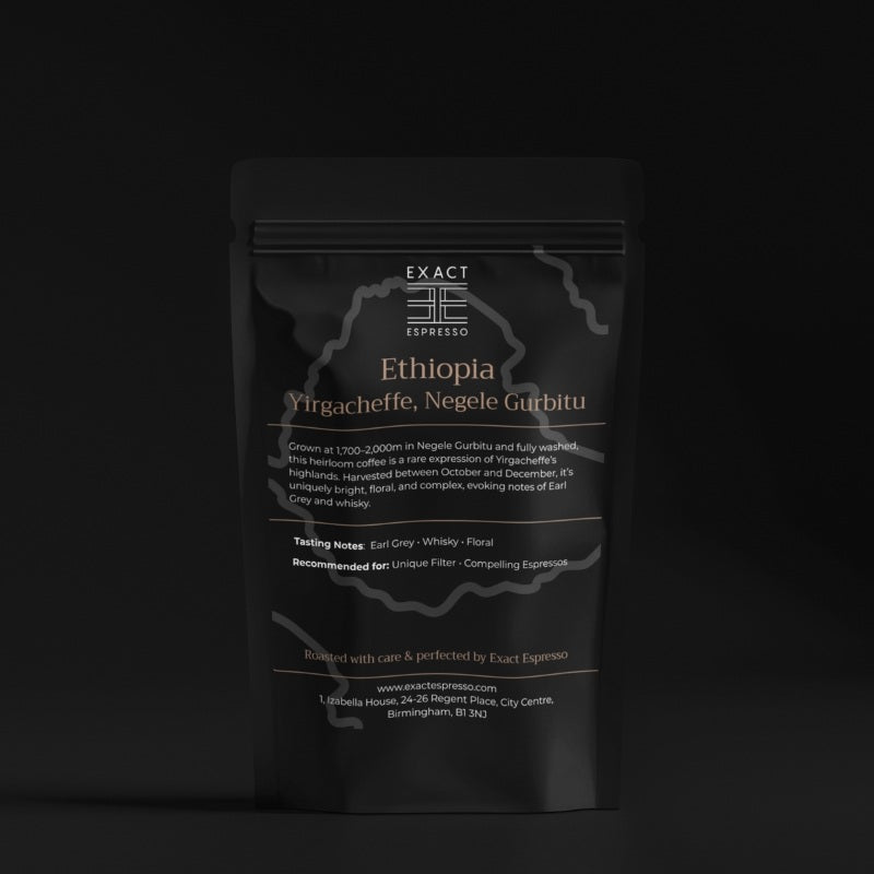 Dark-toned product image of Ethiopia Yirgacheffe coffee bag with subtle lighting and black backdrop.